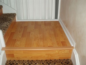 Wooden platform bed frame with a leopard print carpet beneath.