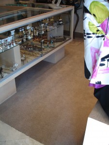 A display case with eyeglasses inside a store.