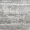 Abstract textured wall with gray and white tones.