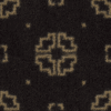Close-up of a dark fabric with a symmetrical gold pattern.