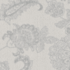 Close-up of a textured fabric with a subtle floral pattern.