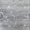Close-up of white marble with gray veining patterns.